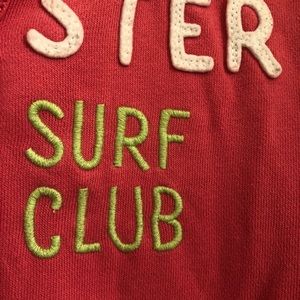 Hot pink hooded jacket with green accent